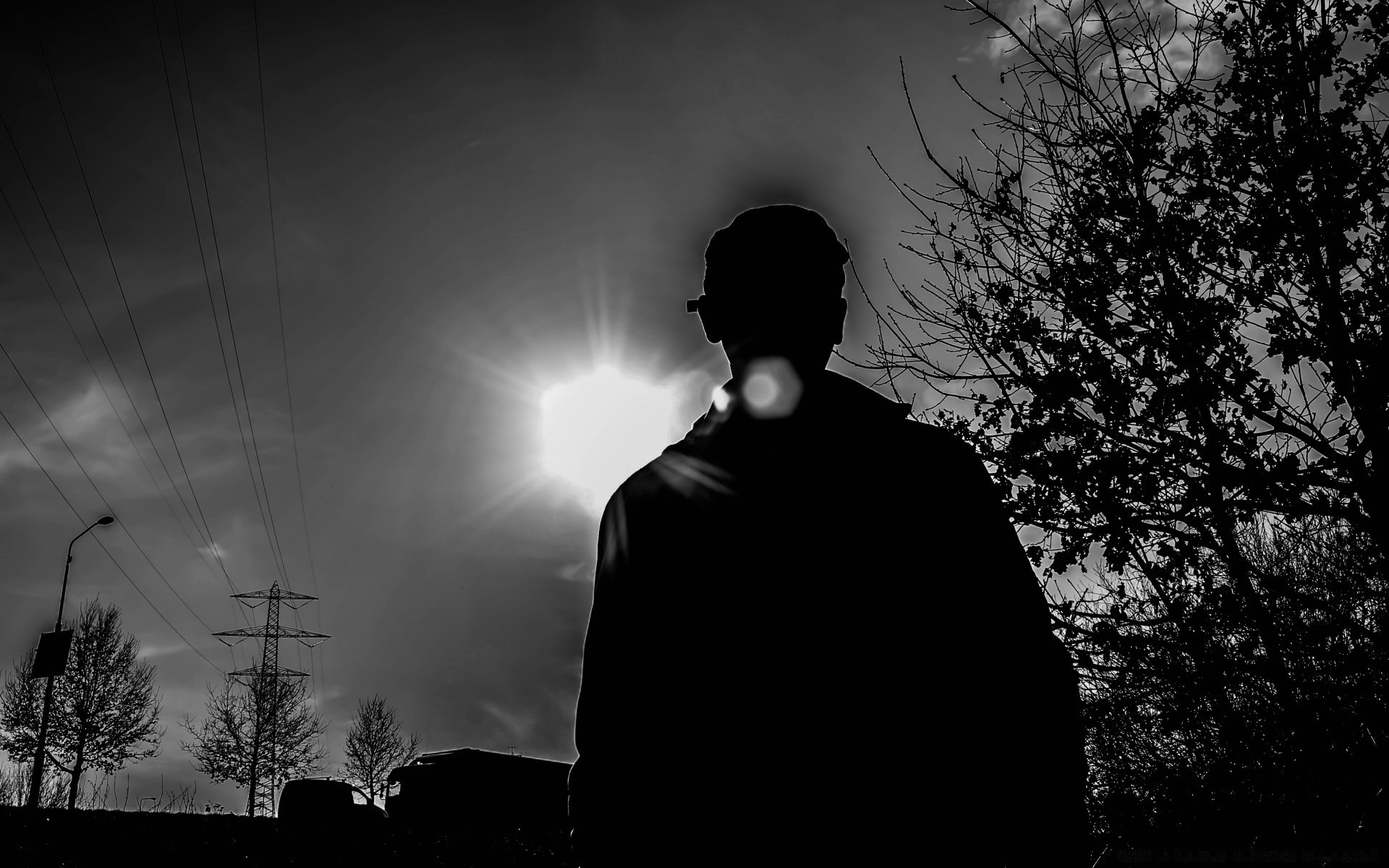 bianco e nero silhouette in bianco e nero uomo tramonto luce sole scuro ombra cielo illuminato ritratto