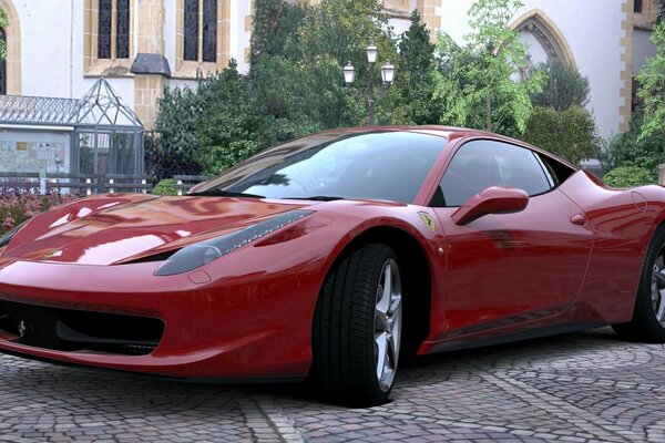 Auto sportiva rossa parcheggiata nel cortile