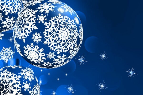 Giocattoli di Natale dipinti con fiocchi di neve
