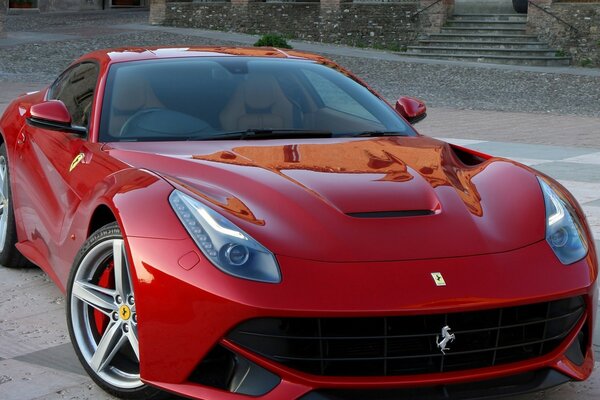Porsche sportiva rossa sui dischi